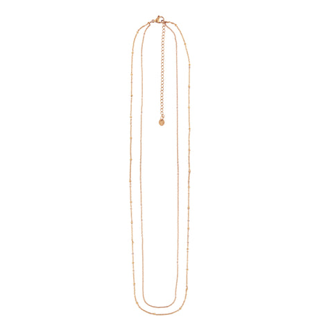 Tavira women's waist chain by Five Jwlry, featuring two layered chains: the first is a thin cable chain and the second is a thin cable chain adorned with a row of beads. Adjustable in size from 68cm to 86cm, in rose gold colored, water-resistant 316L stainless steel. Hypoallergenic with a 2-year warranty.