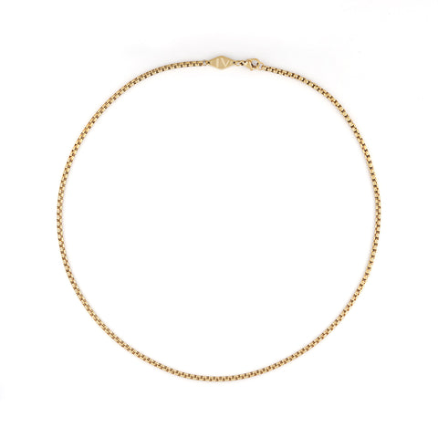 Introducing 'Tone' – a men's necklace by Five Jwlry, crafted in Montreal. It showcases a 2.5mm rounded box chain in a 14k gold, adorned with the brand's distinct lozenge-shaped logo tag.