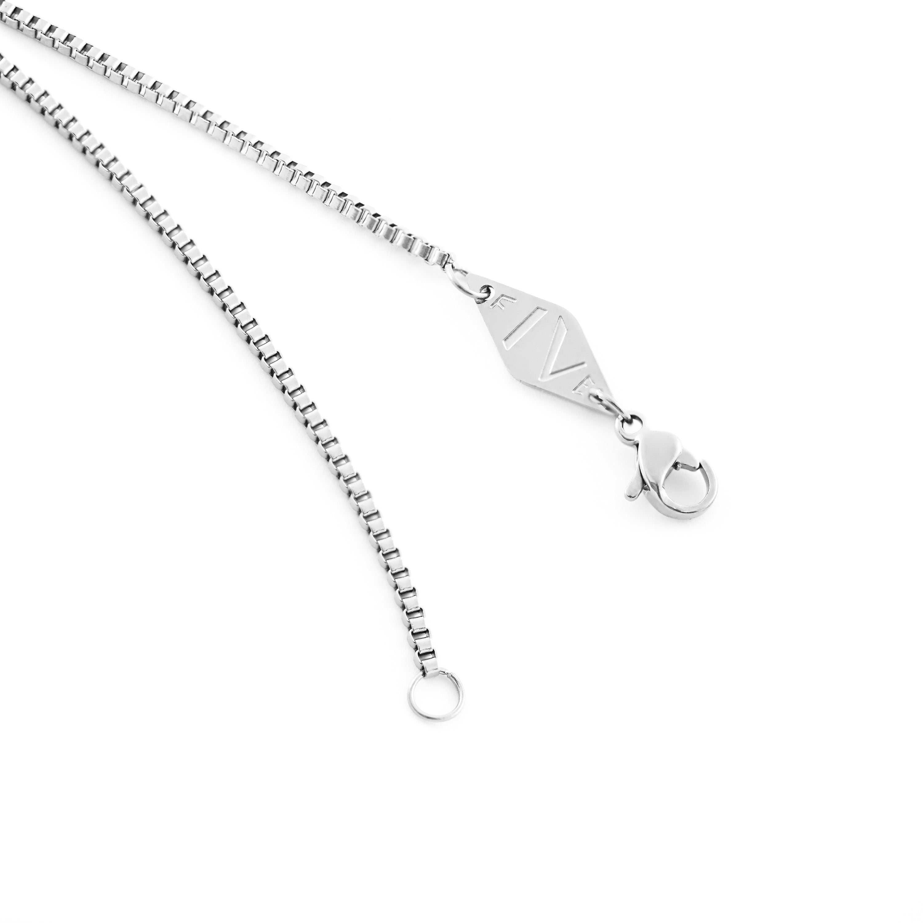 Clyd necklace by Five Jwlry for men, designed in Montreal. Features a 1.5mm square box chain in silver color, highlighted with the brand's signature logo tag.