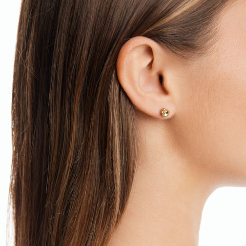 "Dawn women's stud earring by Five Jwlry, a creation from Alicia Moffet's collaboration, where classic stud design meets the fluidity of water, inspired by a single water droplet. Choose from 14k gold or silver for this unique piece, made from water-resistant 316L stainless steel. Hypoallergenic with a 2-year warranty.