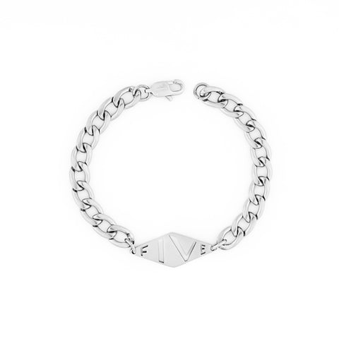 Dal bracelet by Five Jwlry for women, uniquely designed in Montreal, showcasing a wide woven Cuban link chain in silver color, adorned with the brand's signature lozenge logo tag