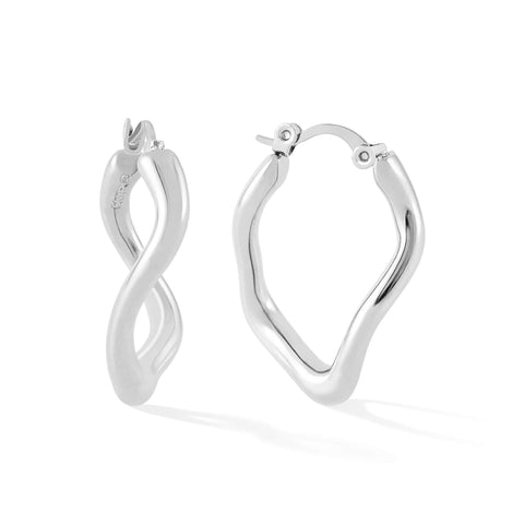 Dusk women's hoop earring by Five Jwlry, a distinctive creation from Alicia Moffet's collaboration. It features an organic, one-of-a-kind design, making it a standout piece. Available in 14k gold or silver, crafted from water-resistant 316L stainless steel. Hypoallergenic with a 2-year warranty.