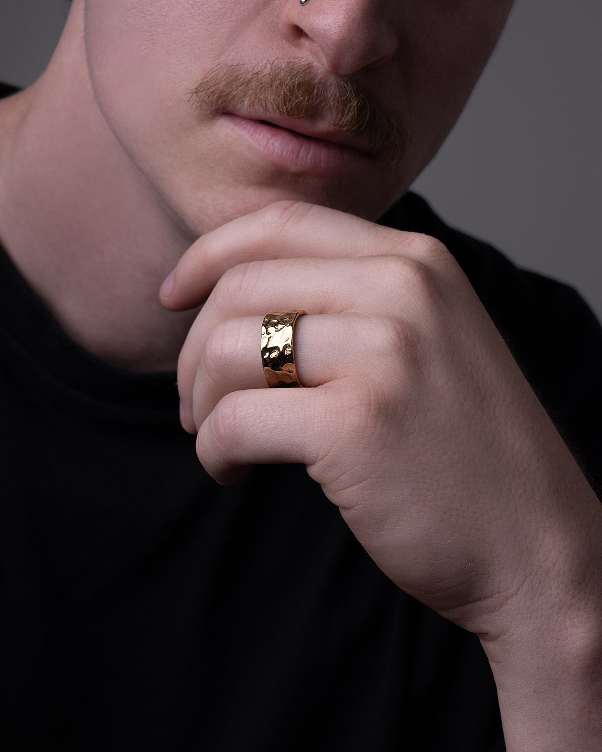 LUNE ring, designed in Montreal and made of waterproof and hypoallergenic stainless steel in a 14k gold hue. Its unique design boasts delicate bumps, embodying a perfectly imperfect aesthetic inspired by the lunar landscape with its craters and golden reflections.