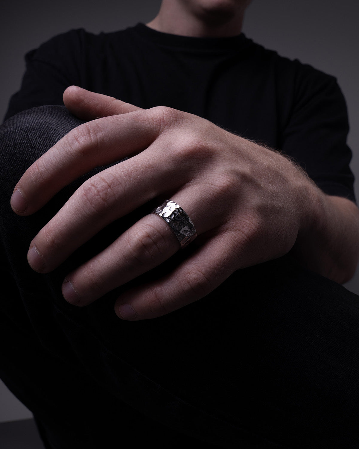 LUNE ring, designed in Montreal and made of waterproof and hypoallergenic stainless steel in a silver color. Its unique design boasts delicate bumps, embodying a perfectly imperfect aesthetic inspired by the lunar landscape with its craters and golden reflections.