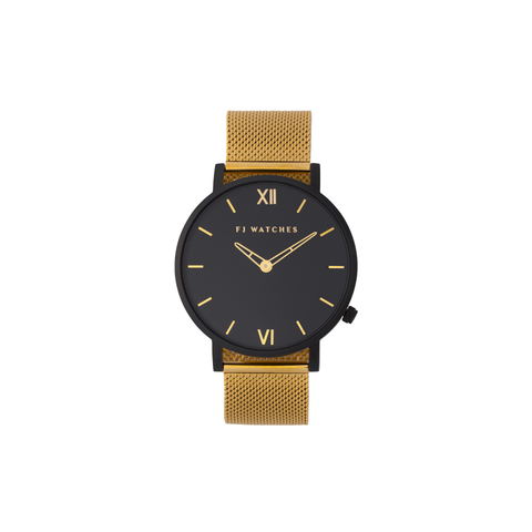 Discover Oro moon, a 36mm women's watch signed Five Jwlry with an all-black dial and gold hands. This one can be paired with a gold or black mesh bracelet!